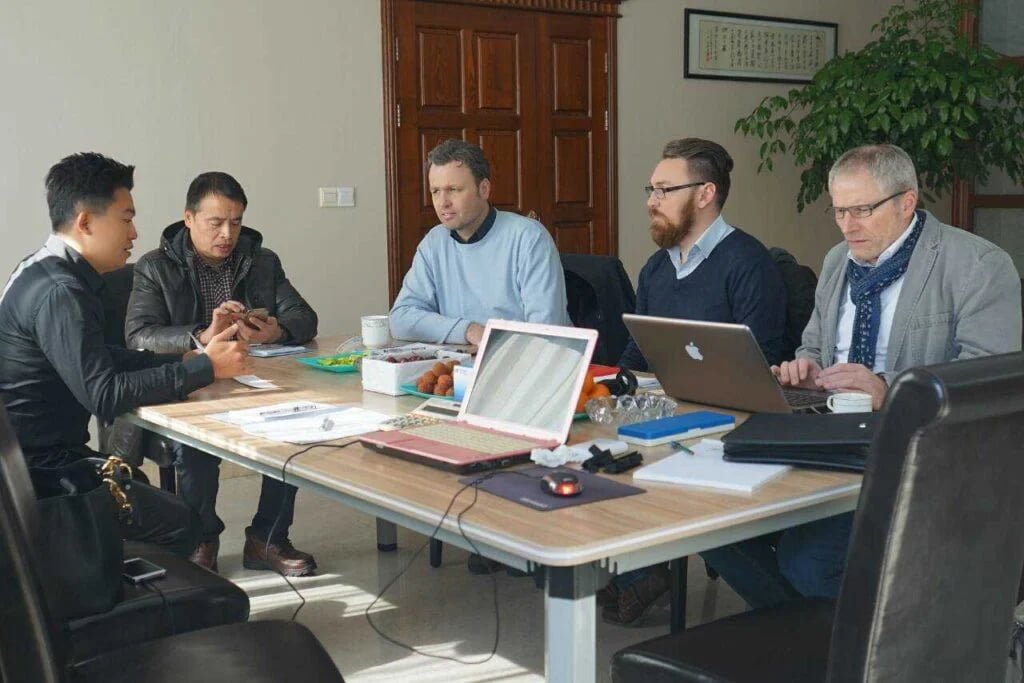 Julong Rubber team discussion with clients